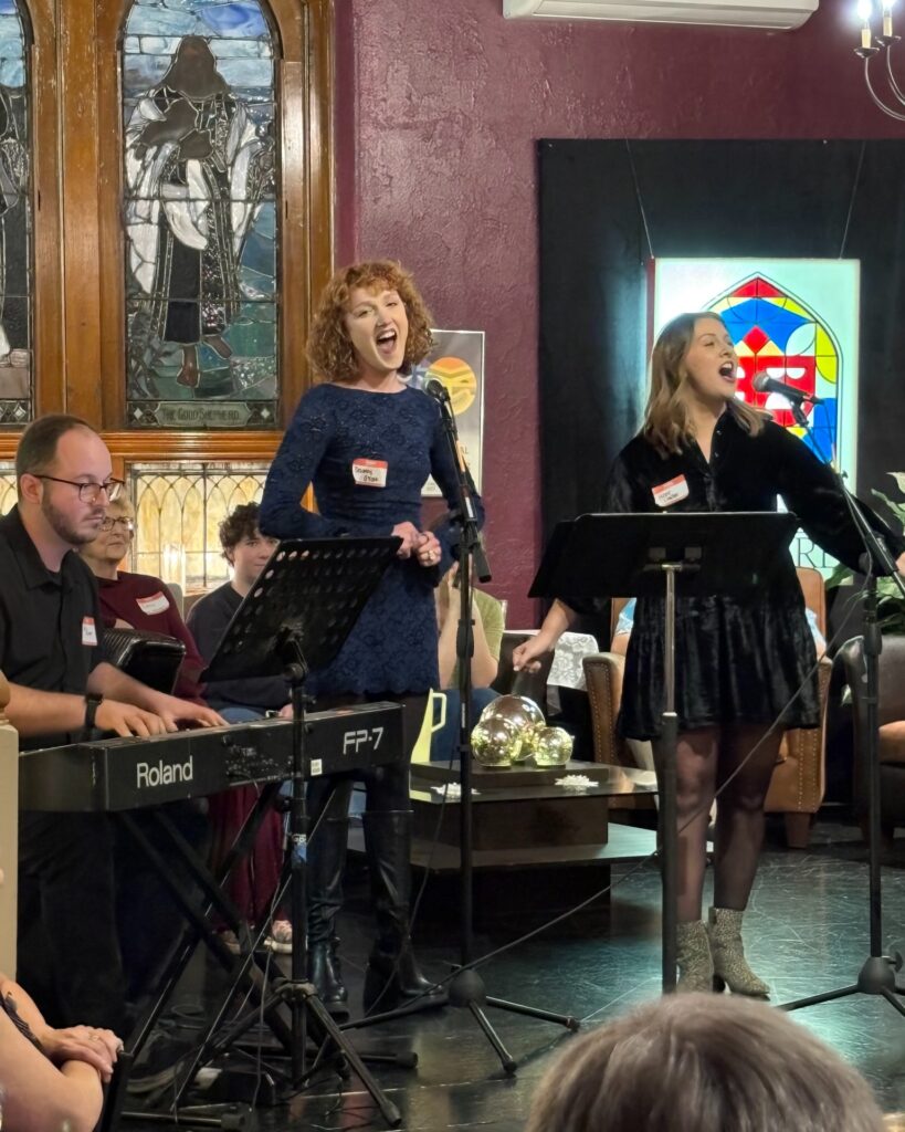  Hope Louden and Delaney O'Toole sing with Guys and Dolls music director, Joe Rivers.